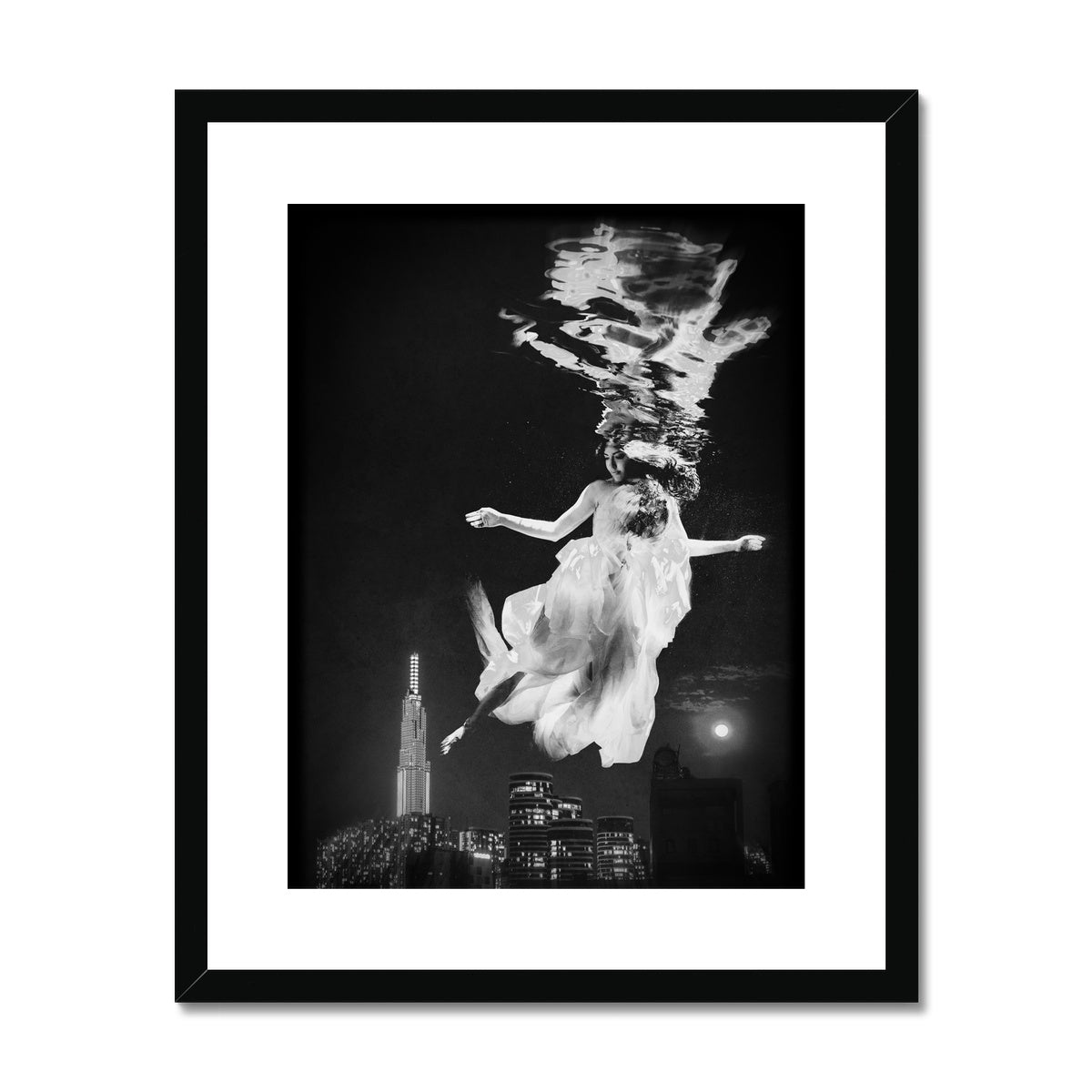 06 - Surreal dreamy poster of the protecting girl / goddess / mermaid floating in the sky over the city, wrapped in the night Black and White Framed & Mounted Print Pimamour Original Pimamour