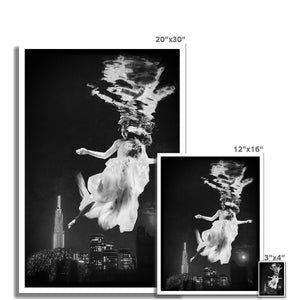 06 - Surreal dreamy poster of the protecting girl / goddess / mermaid floating in the sky over the city, wrapped in the night Black and White C-Type Print Pimamour Original Pimamour